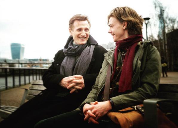 Liam Neeson and Thomas Brodie-Sangster filming the Love Actually sequel.