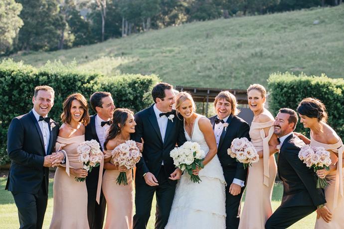 The bride and groom share a laugh with their bridal party. (Image/Daniel Griffith Photography)