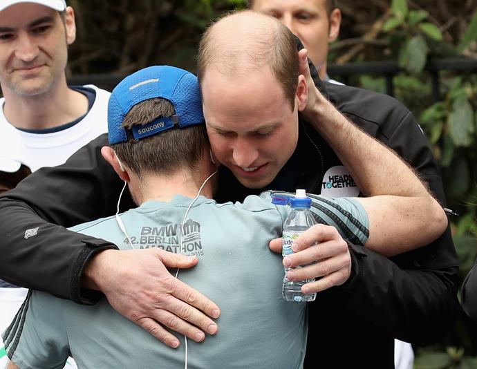 A touching moment - Prince William hugs a runner.