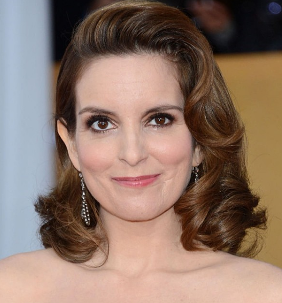 "You're just like a human napkin for kids, like, they just wipe their face on you and stuff." Tina Fey on motherhood.