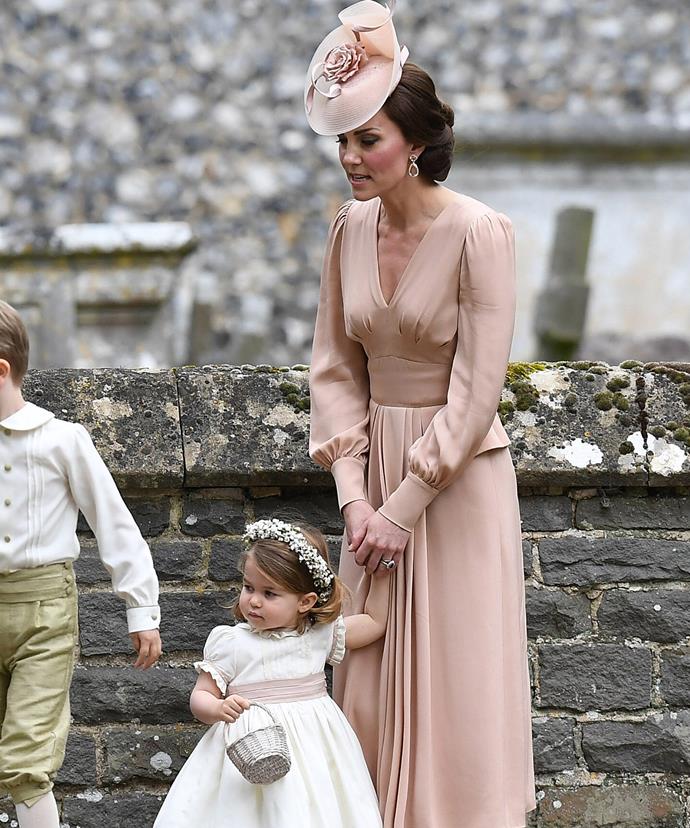Catherine looked lovely in a blush-pink silk dress by Alexander McQueen.