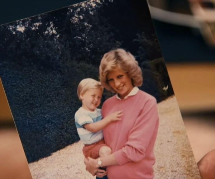 The royal brothers have shared this never-before-seen photo of a pregnant Diana holding a young Prince William. **(Image/ITV)**