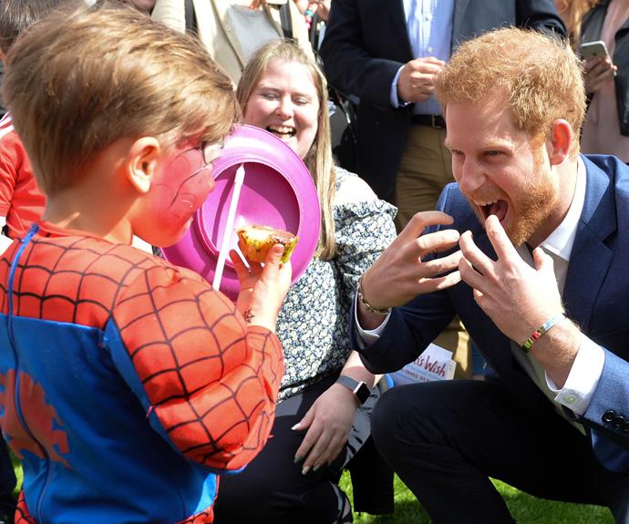 Indulging his inner *Spider-Man* during a garden party at Buckingham Palace in May. **Related video: the royal's best hugs. Post continues after!**