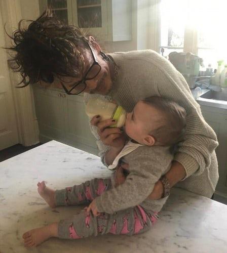 **Steven Tyler:** The Aerosmith frontman looked less like a rocker and more like a doting grandpa when his daughter, Liv, shared this photo of him feeding his new granddaughter, Lula. "Papa Steven," she captioned.
