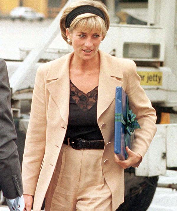 Airport chic! The Princess of Wales gets ready to make her way to New York in June 1997.