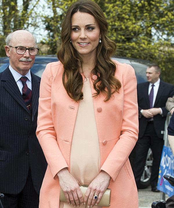 Kate wore this Tara Jarmon orange outfit on her second anniversary, April 29, 2013.
