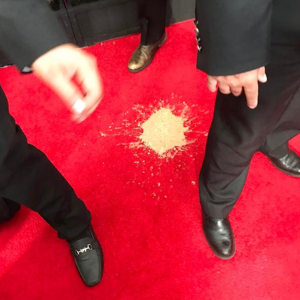 Someone actually threw up on the red carpet, grossing us out big time...We'd love to know the culprit!