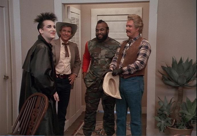 **Boy George –** ***The A-Team***
In one of the strangest cameos ever seen in TV land, Culture Club lead singer Boy George joined soldiers of fortune Hannibal (George Peppard), Murdock (Dwight Schultz), Face (Dirk Benedict), and B.A. Baracus (Mr. T) in a special episode of 80s action show *The A-Team*. 
George got to kick down a door and drive the team’s iconic 1983 GMC van while Mr. T strutted his inimitable stuff as the band played “Karma Chameleon”. Remember, if you have a problem, if no one else can help, and if you can find them.... maybe you can hire The A-Team. Or Boy George.