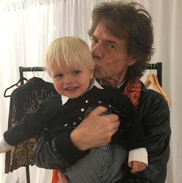 **Mick Jagger**: Snapped here with his adorable grandson, Ray, The Rolling Stones' rocker is a father to eight children, a grandfather to five *and* a great-grandfather to another.