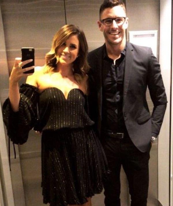 Georgia Love shared a standard lift selfie ahead of the big day. She may have skipped on the head-piece but she has her favourite accessory in tow... Lee Elliott.