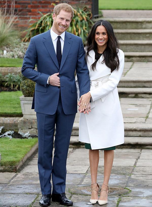 Meghan rugged up in a stylish white coat-dress by Canadian designer Line the Label.