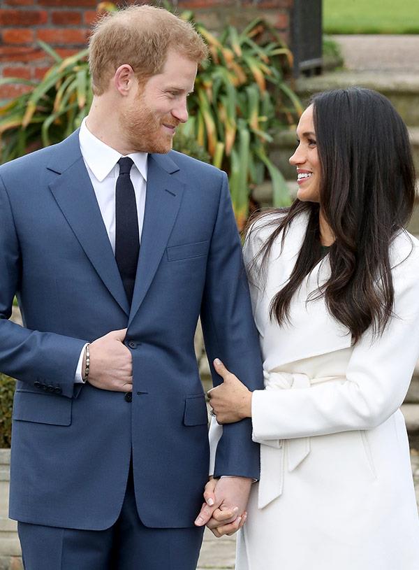 Harry nervously put his hand in his pocket but Meghan's warm embrace shows she's trying to calm his jitters.