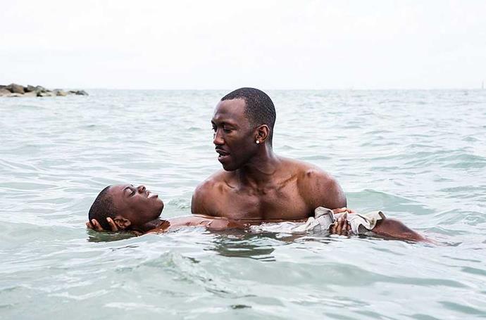 **Moonlight**
Moonlight is no fun, light rainy Sunday afternoon movie. It's dark, intense and emotional and that is exactly why it won the Oscar for Best Picture (and many other awards) at this year’s Academy Awards. *Moonlight* chronicles the coming of age story of an African-American man from childhood to adolescence and adulthood. This heartbreaking story explores the man’s troubling life experiences growing up in a rough part of Miami while trying to understand his own sexuality. *Moonlight* is a deeply personal story that will stay with you long after the credits start rolling. 