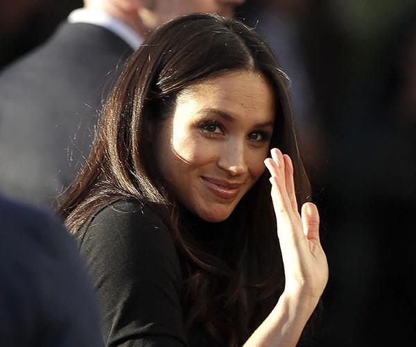 Meghan still needs to work on her royal wave.