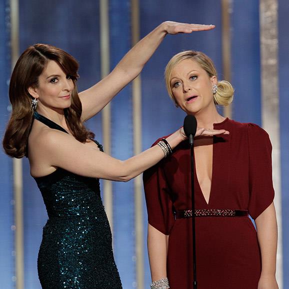 **Tina Fey and Amy Poehler take down the men of Hollywood.** Hosts Tina and Amy's opening monologues are always comedic genius. "And now, like a supermodel's vagina, let's all give a warm welcome to Leonardo DiCaprio…" was an unforgettable segue at the 2014 show. And how could we forget the time the ladies took down Hollywood king George Clooney: "George Clooney married Amal Alamuddin this year. Amal is a human rights lawyer who worked on the Enron case; was an adviser to Kofi Annan regarding Syria; and was selected for a three-person UN commission investigating rules of war violations in the Gaza Strip. So tonight… her husband is getting a lifetime achievement award." Bravo!