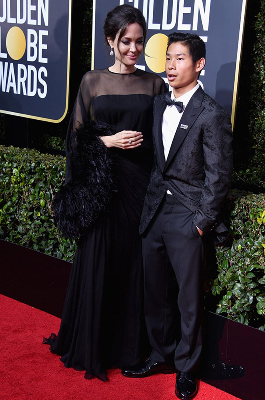Angelina seems mighty impressed with her date, son Pax.