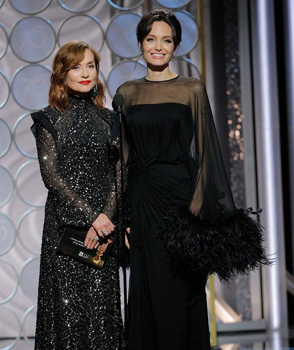 Close call! Angelina Jolie and Isabelle Huppert introduced the nominees for Best Performance by an Actress in a Motion Picture - Drama, just a [few moments after Jennifer Aniston was on stage...](https://www.nowtolove.com.au/celebrity/celeb-news/angelina-jolie-and-jennifer-aniston-at-the-golden-globes-44008|target="_blank") Interestingly, Jen skipped walking the red carpet. This marks the first time Brad Pitt's love rivals have been in the same room for the first time in three years!