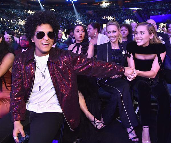 Bruno Mars and Miley Cyrus are thrilled to be reunited.