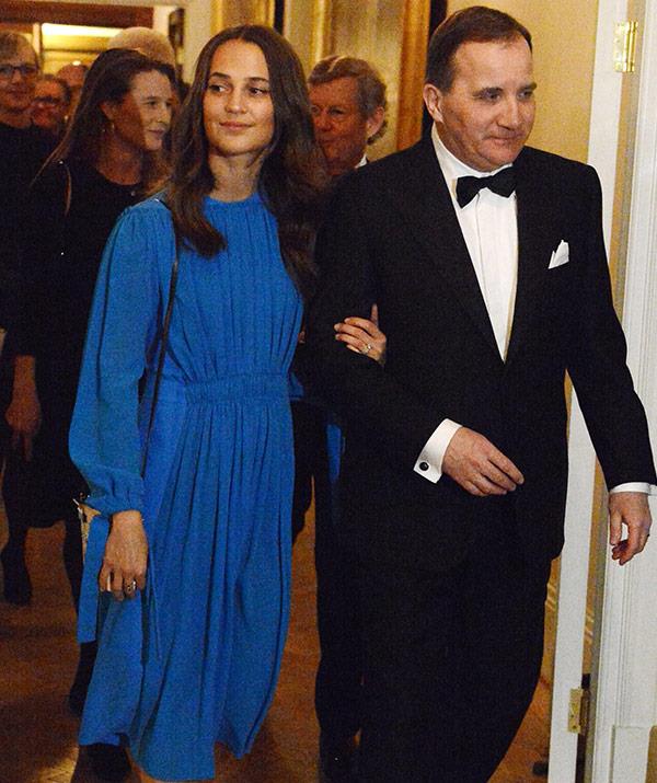Swedish actress Alicia Vikander is escorted by Prime Minister Stefan Lofven.