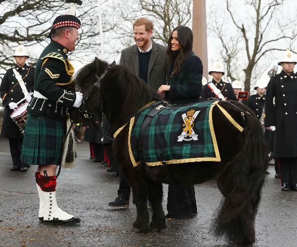 Upon arrival, the newly-engaged couple were greeted by the Band of Royal Marines and their mascot, an adorable Shetland pony named Cruachan.