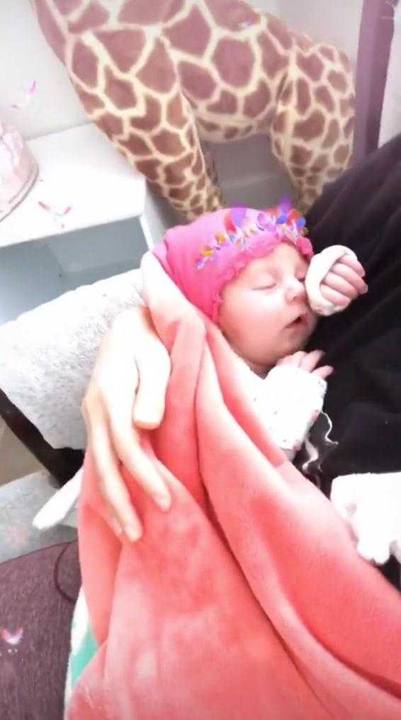 Lisa took this cute video of herself rocking Minnie to sleep and posted it on Instagram Stories!