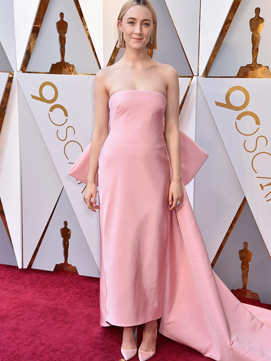Best Actress nominee Saroise Ronan opts for a strapless pink dress with a feature bow on the back.
