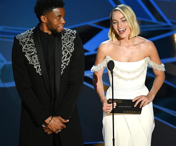 Actor Chadwick Boseman and actress Margot Robbie present the Oscar for Best Adapted Screenplay.
