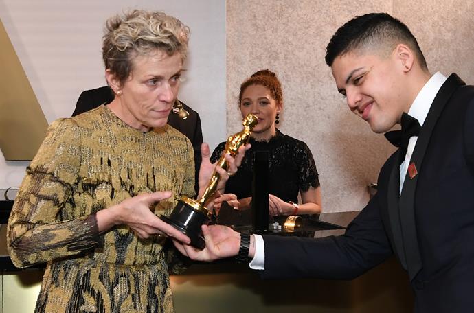Frances McDormand was more than happy to show off her new award at the 90th Annual Academy Awards Governors Ball.