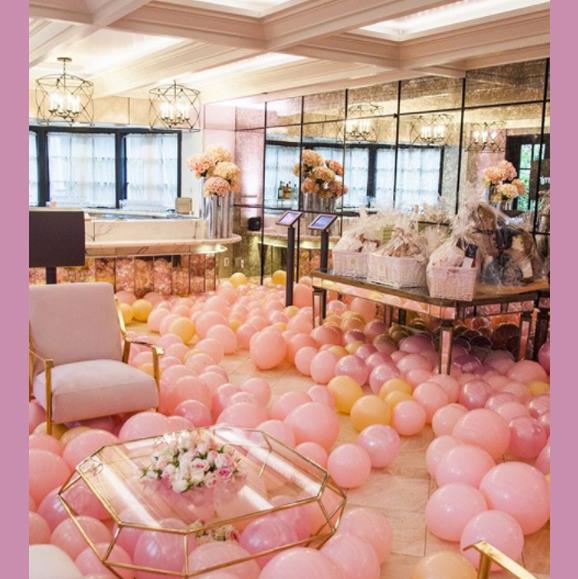 Hundreds of pink and peach balloons decorated the lavish Hotel Bel Air.
