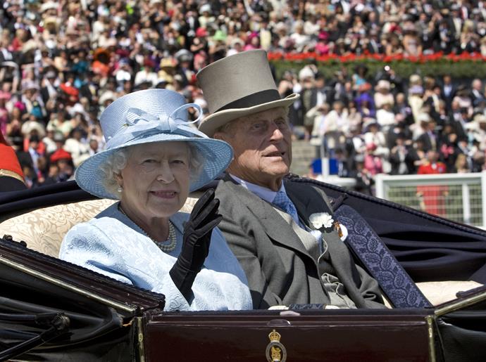 Her majesty waves to crowds as she arrives for Ladies Day At Royal Ascot, Berkshire in 2008 wearing her silk, baby blue ensemble yet again.