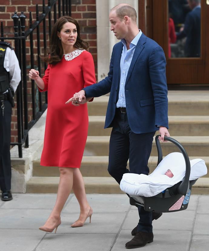 William took to the driver's seat of a waiting car while Kate sat in the backseat with her precious new bundle of joy.