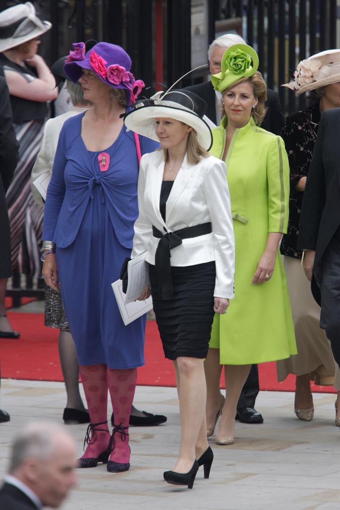 The combination of a purple ruched dress, pink polka-dot tights, and a rosette hat on this guest at Prince William and Catherine Middleton's wedding was an interesting choice!