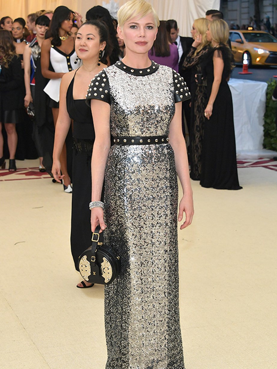 Michele William shines in a sleek sequined gown with studded leather details.