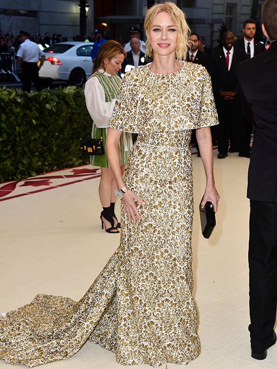 Simply stunning! Naomi Watts is a vision in white and gold.