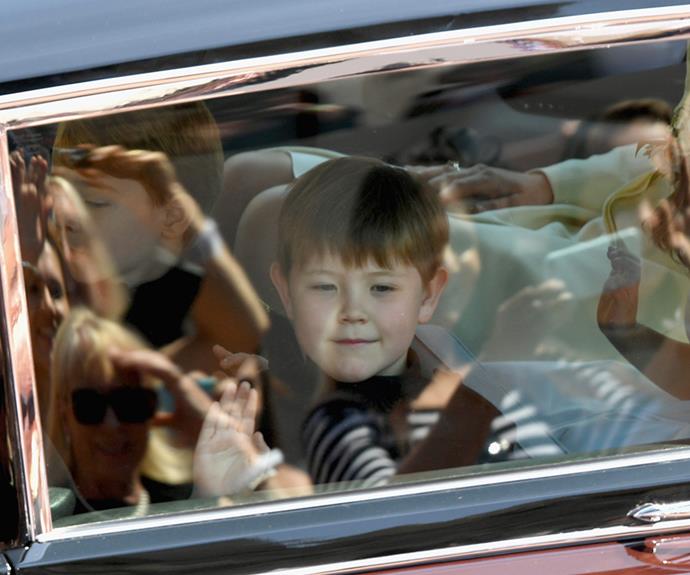 Jasper Dyer waves to crowds as he arrives at the royal wedding.