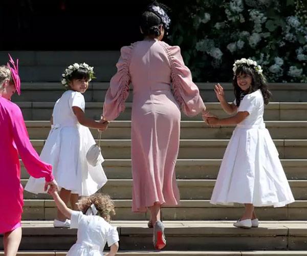 Benita's twins Rylan and Remi served as bridesmaid on their aunt Meghan's special day.