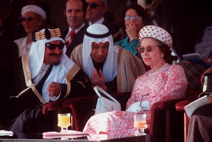Cool as a cucumber, the Queen kicks back and chillaxes as she watches a dancing display in Kuwait with Sheikh Abdullah Jabir.
