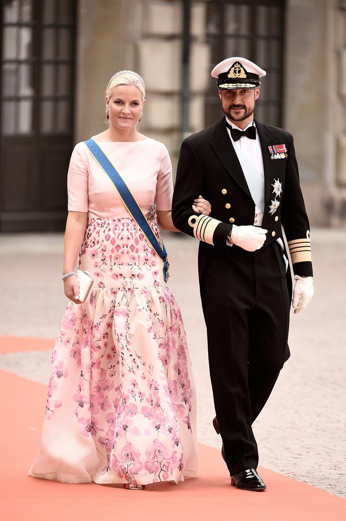 Crown Princess Mette-Marit of Norway chose a floral palette when she attended the royal wedding of Prince Carl Philip of Sweden and Sofia Hellqvist.