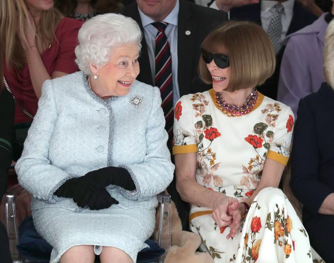 The Queen sitting front and centre (with her knees facing forward) with *Vogue* editor Anna Wintour during last year's London Fashion Week.