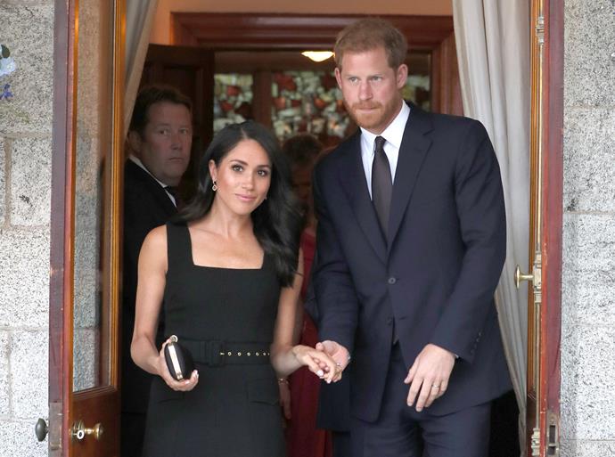 Harry and Meghan arrived at the garden party hand-in-hand.