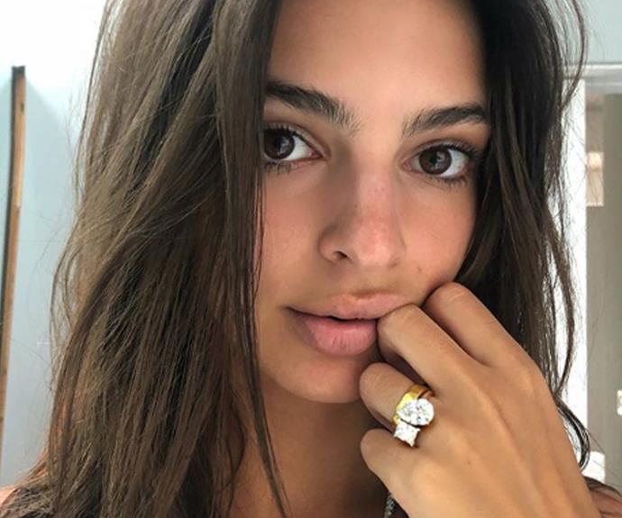 Put on your sunglasses, Emily Ratajkowski's double-diamond ring is a blinder! Fourth months after her wedding to Sebastian Bear-McClard the stunning model revealed her custom bling on social media. The ring features both square-cut and pear-cut diamonds, coupled together on what appears to be one band. The jewels are accompanied by her gold wedding band.