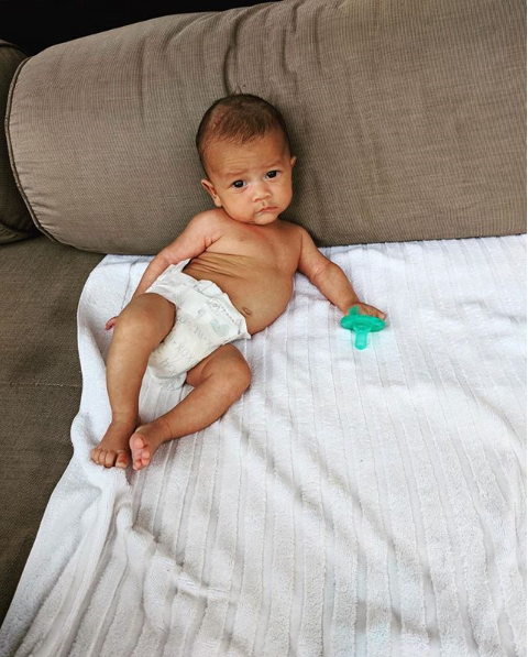 Little brother to big sister two-year-old Luna, [Miles Legend made his way into the world in May](https://www.nowtolove.com.au/parenting/celebrity-families/chrissy-teigen-baby-announcement-48468|target="_blank"), and his hilarious parents, Chrissy Teigen and John Legend [have been making us smile](https://www.nowtolove.com.au/parenting/celebrity-families/chrissy-teigen-spills-breastmilk-50050|target="_blank") with his pictures ever since. He's a mini-John, right?