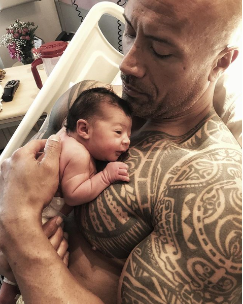 Dwayne 'The Rock' Johnson and partner Lauren Hashian welcomed a sweet baby girl, [Tiana Gia, into the world in April.](https://www.nowtolove.com.au/parenting/celebrity-families/dwayne-the-rock-johnson-third-baby-46746|target="_blank") "Tiana Gia Johnson came into this world like a force of nature and mama @laurenhashianofficial labored and delivered like a true rockstar," he wrote on Instagram, celebrating his long-term partner Lauren Hashian's birth of his little girl. "I was raised and surrounded by strong, loving women all my life, but after participating in baby Tia's delivery, it's hard to express the new level of love, respect and admiration I have for @laurenhashianofficial and all mamas and women out there."