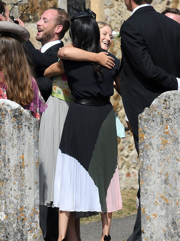 Meghan greets friends at the entrance to the church.