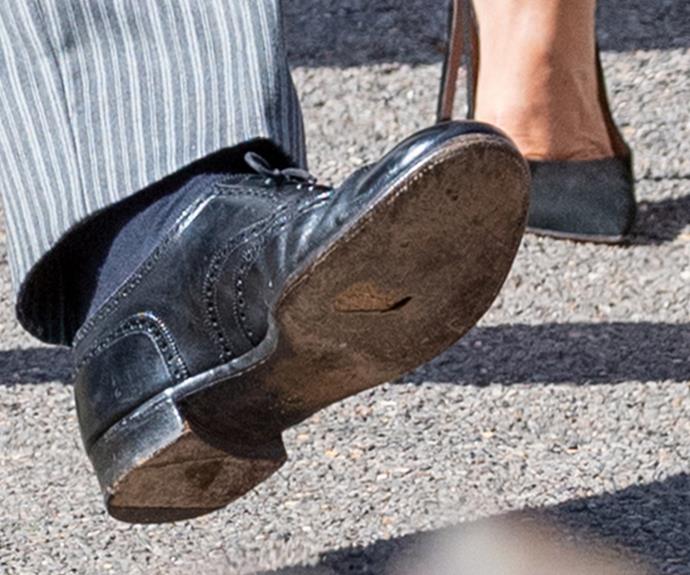 Until...A close up of Harry's black brogues reveals the Prince has a hole in his sole!