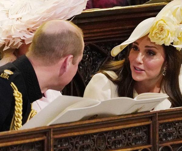 Kate and Wills share a fun moment at Harry's wedding.
