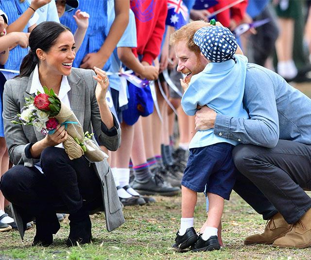 Hug it out! Local school boy Luke was thrilled to meet the Duke and Duchess of Sussex.