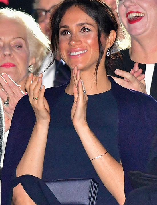 For her accessories, Meghan held a Dior clutch bag and wore some sparkling sapphire diamond drop earrings. *(Image: Getty Images)*