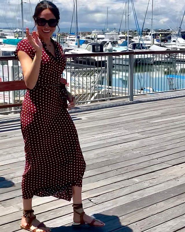 Finishing the look with a pair of brown gladiator sandals and large black sunglasses, the Duchess was the image of effortless chic. *(Image: Instagram / @herveybayecomarinetours)*