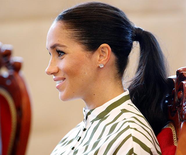 The Duchess wore her dark hair in a chic pony-tail. *(Image: Getty Images)*